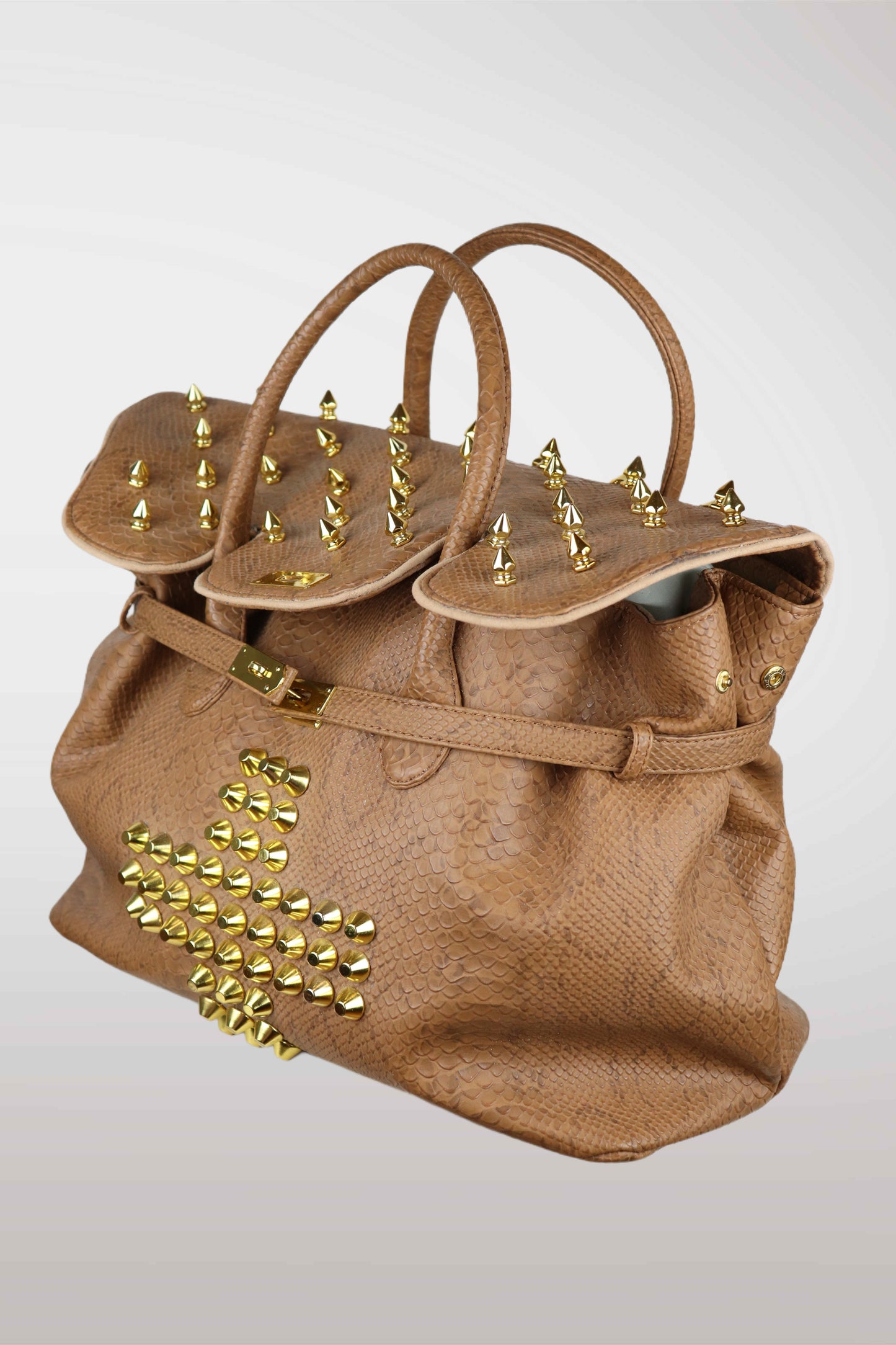 Brown handbag with gold studs on a white background
mint condition vintage
designer archive piece
rare runway sample
one of a kind vintage
limited edition designer
authentic vintage designer
rare vintage designer find
collectible vintage fashion
high-end vintage clothing
luxury vintage apparel
designer vintage statement piece
genuine vintage couture
archival designer clothing
runway vintage fashion
vintage designer investment piece