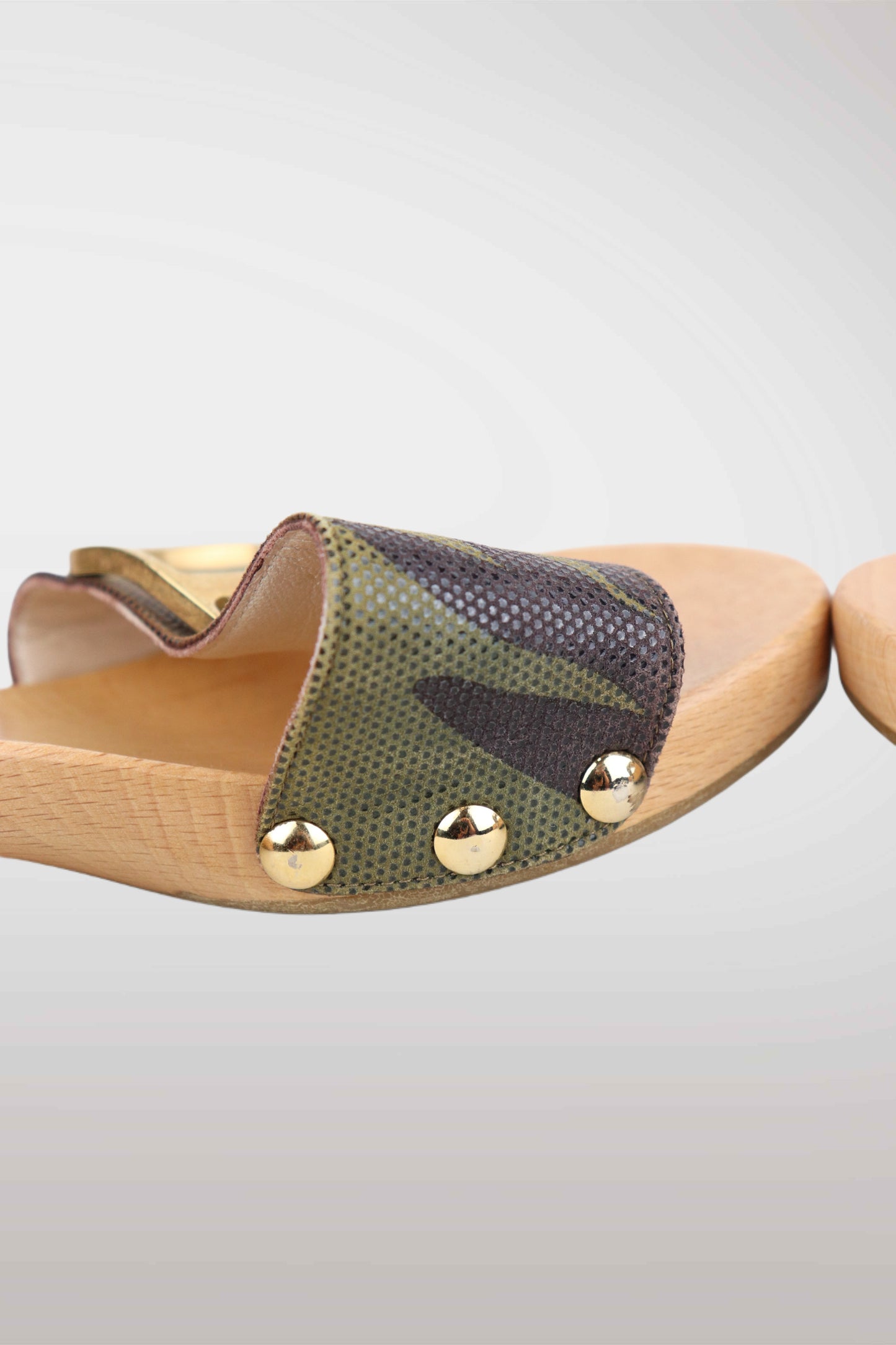 Wooden sandal with green fabric and gold studs on a light gray background
mint condition vintage
designer archive piece
rare runway sample
one of a kind vintage
limited edition designer
authentic vintage designer
rare vintage designer find
collectible vintage fashion
high-end vintage clothing
luxury vintage apparel
designer vintage statement piece
genuine vintage couture
archival designer clothing
runway vintage fashion
vintage designer investment piece