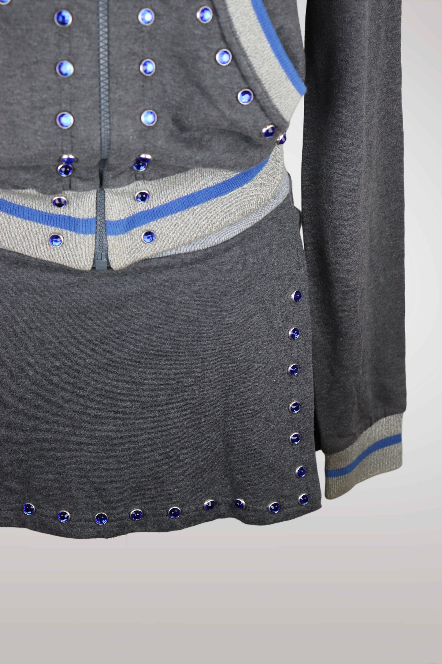 Gray cardigan with blue accents and decorative buttons on a light gray background
mint condition vintage
designer archive piece
rare runway sample
one of a kind vintage
limited edition designer
authentic vintage designer
rare vintage designer find
collectible vintage fashion
high-end vintage clothing
luxury vintage apparel
designer vintage statement piece
genuine vintage couture
archival designer clothing
runway vintage fashion
vintage designer investment piece