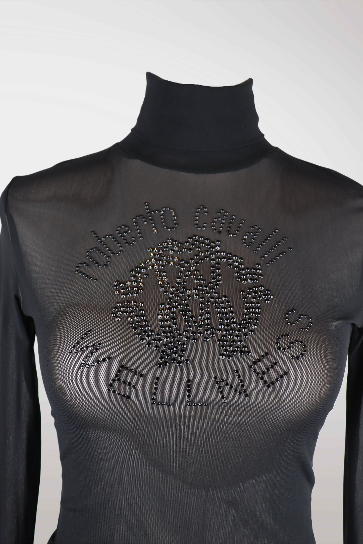 Black turtleneck shirt with rhinestone design and text on a white background
roberto cavalli
mint condition vintage
designer archive piece
rare runway sample
one of a kind vintage
limited edition designer
authentic vintage designer
rare vintage designer find
collectible vintage fashion
high-end vintage clothing
luxury vintage apparel
designer vintage statement piece
genuine vintage couture
archival designer clothing
runway vintage fashion
vintage designer investment piece