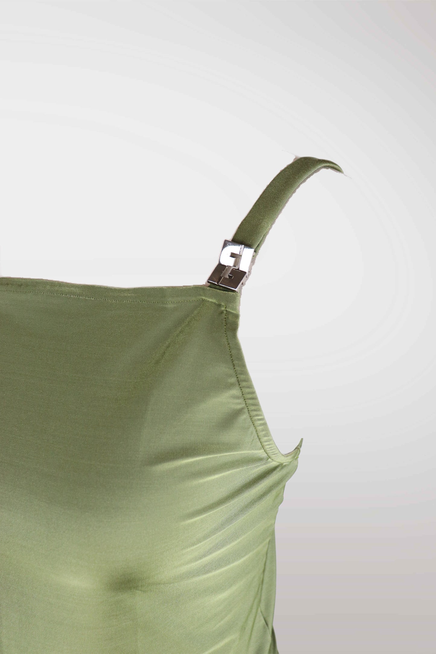 Close-up of a green satin dress with a strap on a light gray background
mint condition vintage
designer archive piece
rare runway sample
one of a kind vintage
limited edition designer
authentic vintage designer
rare vintage designer find
collectible vintage fashion
high-end vintage clothing
luxury vintage apparel
designer vintage statement piece
genuine vintage couture
archival designer clothing
runway vintage fashion
vintage designer investment piece