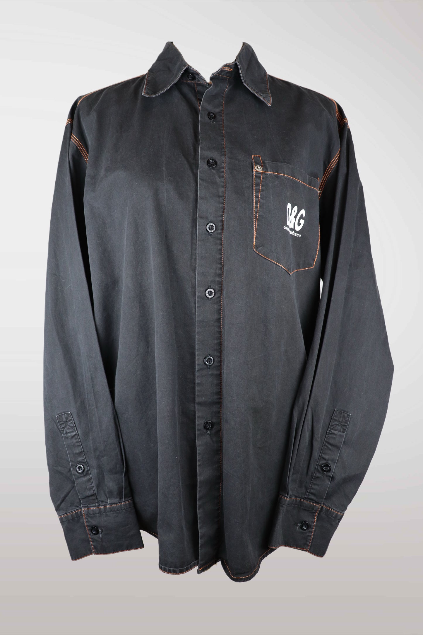 dolce & gabbana Dark gray button-up shirt with a logo on a white background
mint condition vintage
designer archive piece
rare runway sample
one of a kind vintage
limited edition designer
authentic vintage designer
rare vintage designer find
collectible vintage fashion
high-end vintage clothing
luxury vintage apparel
designer vintage statement piece
genuine vintage couture
archival designer clothing
runway vintage fashion
vintage designer investment piece