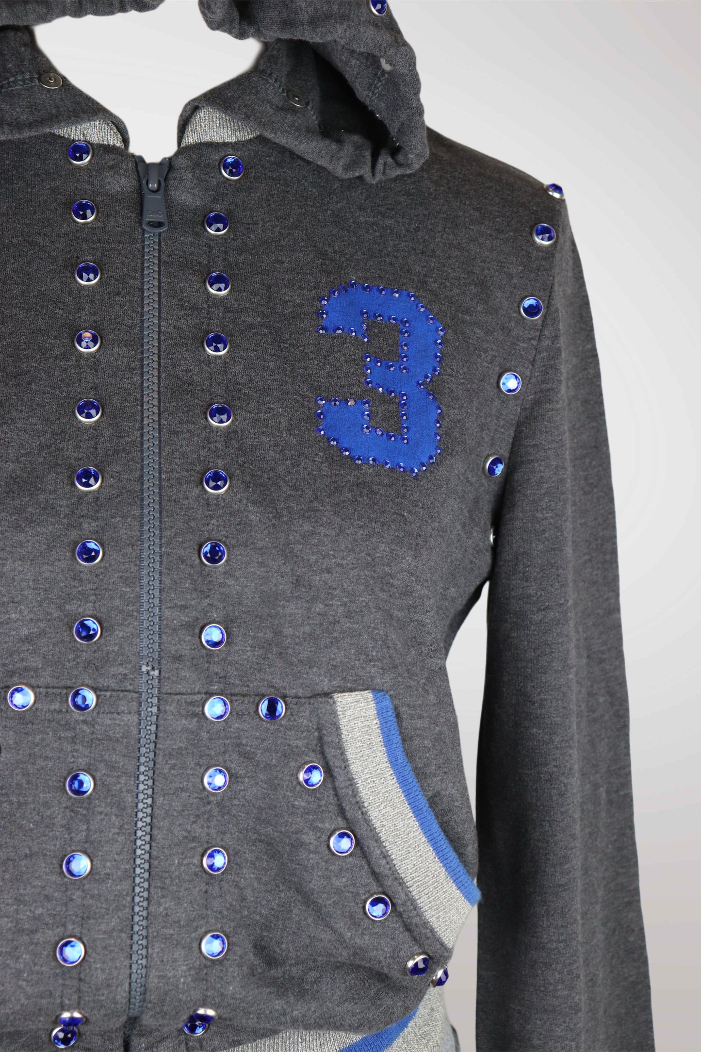 Gray hoodie with blue number 3 and decorative buttons on a white background
mint condition vintage
designer archive piece
rare runway sample
one of a kind vintage
limited edition designer
authentic vintage designer
rare vintage designer find
collectible vintage fashion
high-end vintage clothing
luxury vintage apparel
designer vintage statement piece
genuine vintage couture
archival designer clothing
runway vintage fashion
vintage designer investment piece