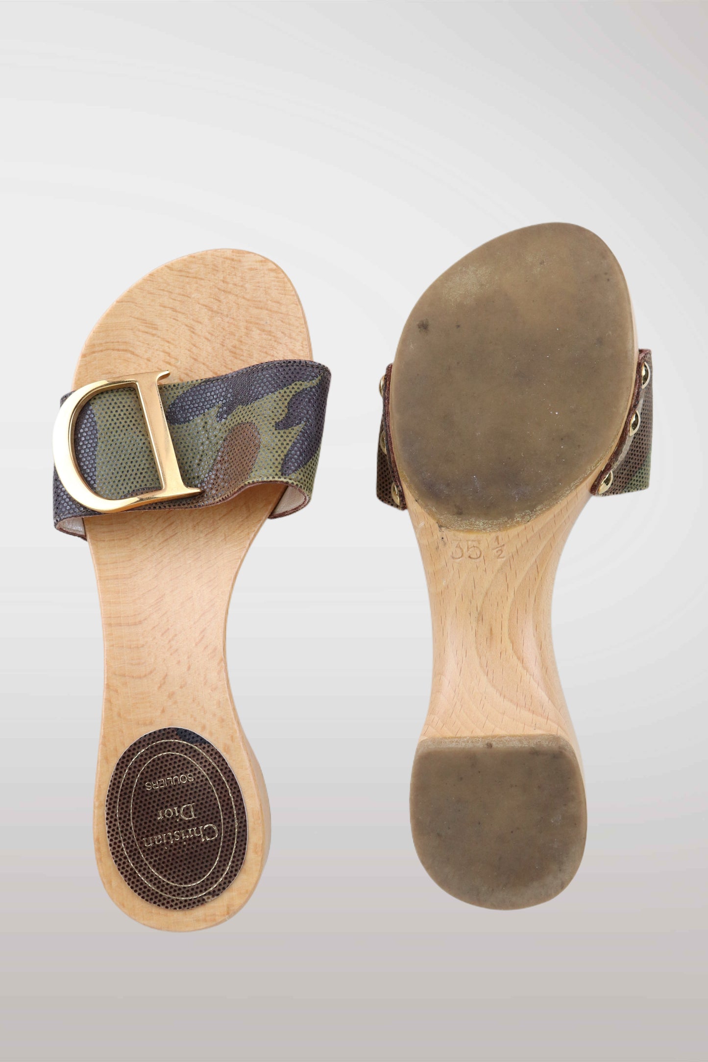 Wooden sandal with a strap and buckle on a light gray background
mint condition vintage
designer archive piece
rare runway sample
one of a kind vintage
limited edition designer
authentic vintage designer
rare vintage designer find
collectible vintage fashion
high-end vintage clothing
luxury vintage apparel
designer vintage statement piece
genuine vintage couture
archival designer clothing
runway vintage fashion
vintage designer investment piece