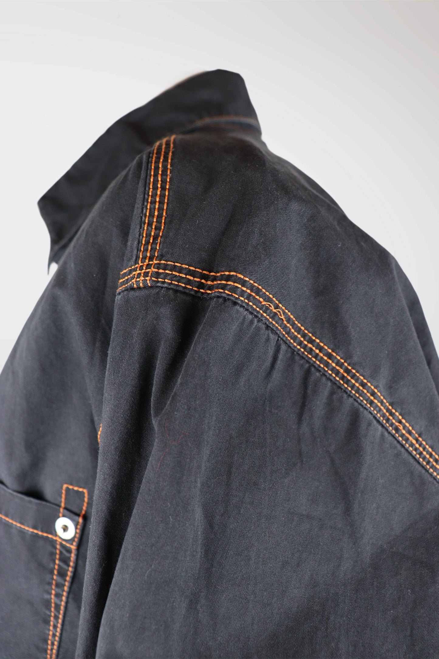 Close-up of a dark dolce & gabbana jacket with orange stitching on a light gray background
mint condition vintage
designer archive piece
rare runway sample
one of a kind vintage
limited edition designer
authentic vintage designer
rare vintage designer find
collectible vintage fashion
high-end vintage clothing
luxury vintage apparel
designer vintage statement piece
genuine vintage couture
archival designer clothing
runway vintage fashion
vintage designer investment piece