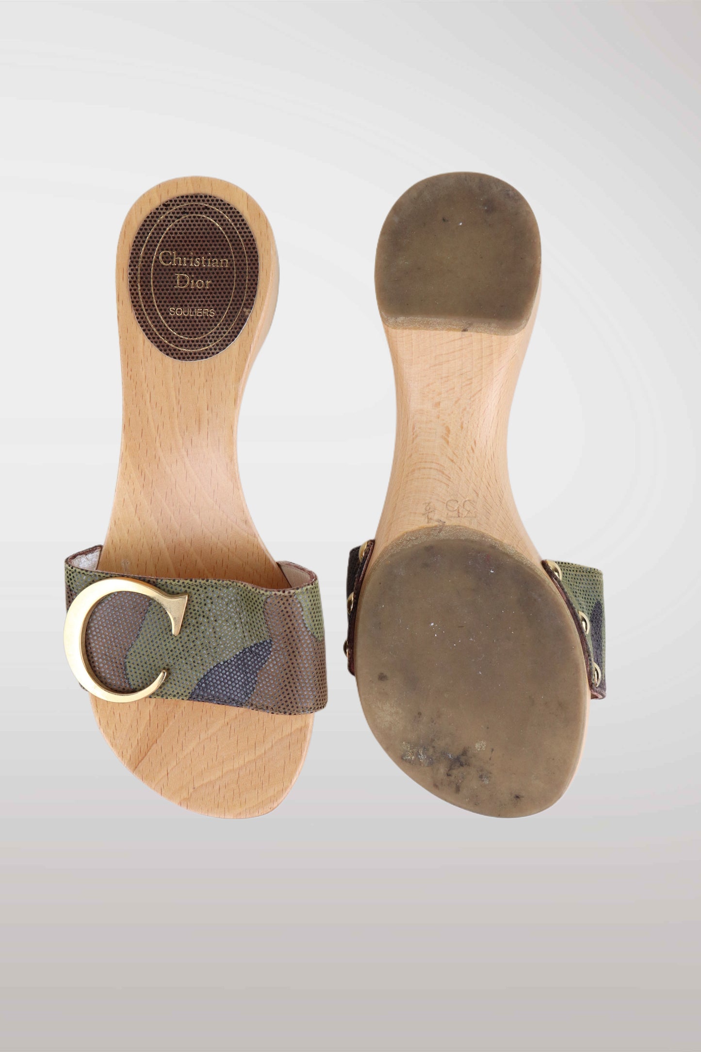 Pair of wooden sandals with camouflage straps on a white background
mint condition vintage
designer archive piece
rare runway sample
one of a kind vintage
limited edition designer
authentic vintage designer
rare vintage designer find
collectible vintage fashion
high-end vintage clothing
luxury vintage apparel
designer vintage statement piece
genuine vintage couture
archival designer clothing
runway vintage fashion
vintage designer investment piece