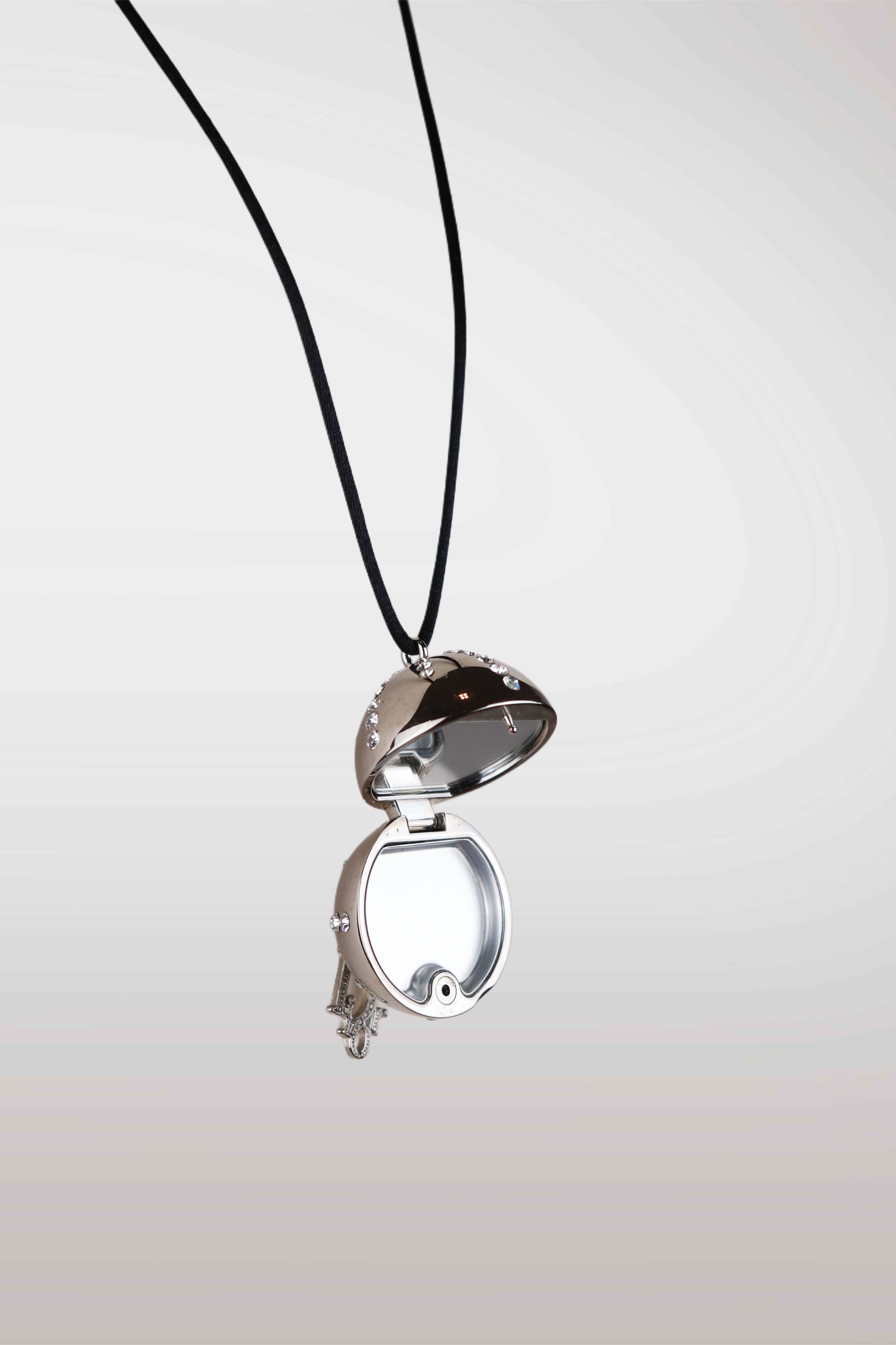 christian dior silver locket with a black cord on a white background
mint condition vintage
designer archive piece
rare runway sample
one of a kind vintage
limited edition designer
authentic vintage designer
rare vintage designer find
collectible vintage fashion
high-end vintage clothing
luxury vintage apparel
designer vintage statement piece
genuine vintage couture
archival designer clothing
runway vintage fashion
vintage designer investment piece