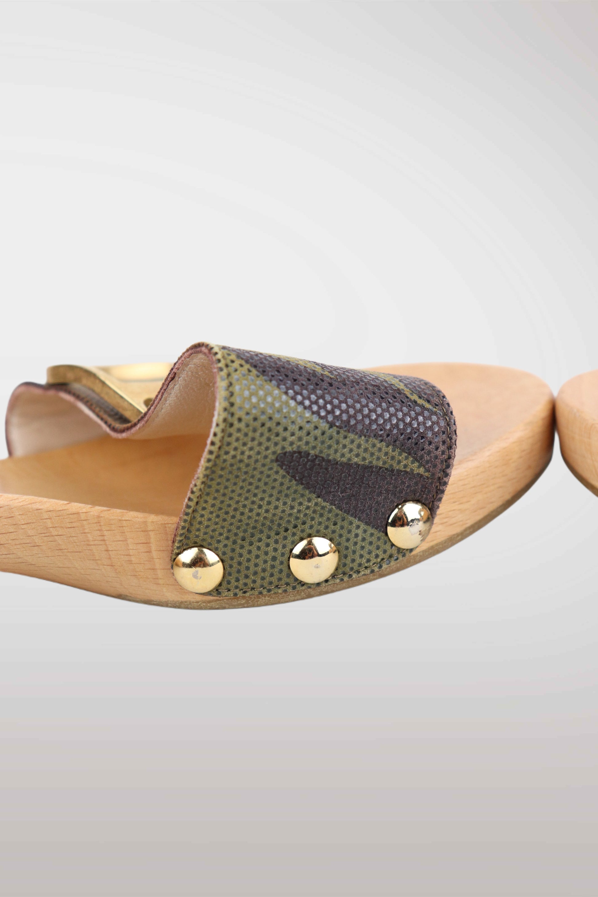 Wooden sandal with green fabric and gold studs on a light gray background
mint condition vintage
designer archive piece
rare runway sample
one of a kind vintage
limited edition designer
authentic vintage designer
rare vintage designer find
collectible vintage fashion
high-end vintage clothing
luxury vintage apparel
designer vintage statement piece
genuine vintage couture
archival designer clothing
runway vintage fashion
vintage designer investment piece