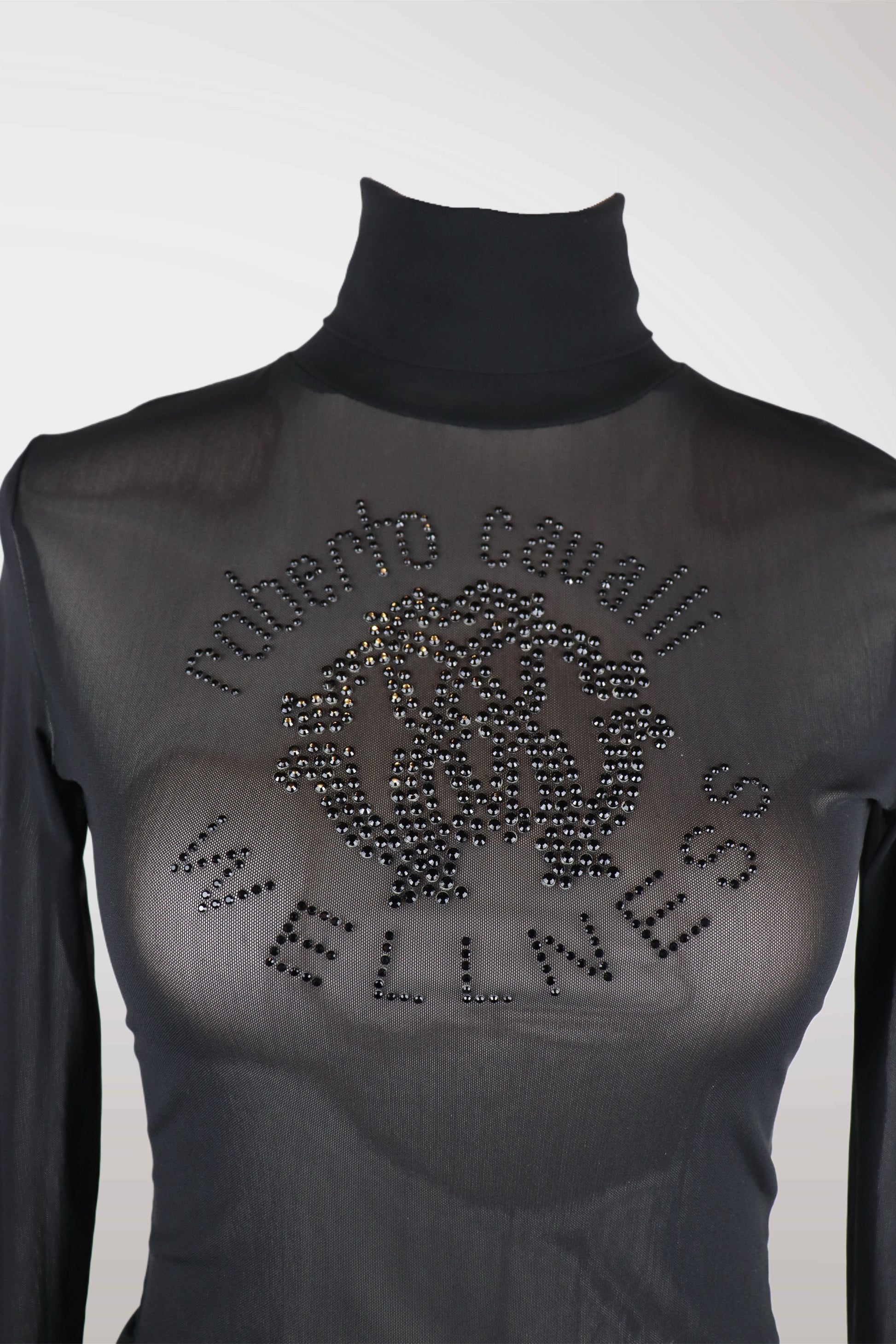 Black turtleneck shirt with rhinestone design and text on a white background

roberto cavalli
mint condition vintage
designer archive piece
rare runway sample
one of a kind vintage
limited edition designer
authentic vintage designer
rare vintage designer find
collectible vintage fashion
high-end vintage clothing
luxury vintage apparel
designer vintage statement piece
genuine vintage couture
archival designer clothing
runway vintage fashion
vintage designer investment piece
