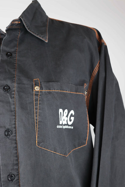 Dark denim shirt with a pocket featuring D&G logo on a white background
mint condition vintage
designer archive piece
rare runway sample
one of a kind vintage
limited edition designer
authentic vintage designer
rare vintage designer find
collectible vintage fashion
high-end vintage clothing
luxury vintage apparel
designer vintage statement piece
genuine vintage couture
archival designer clothing
runway vintage fashion
vintage designer investment piece