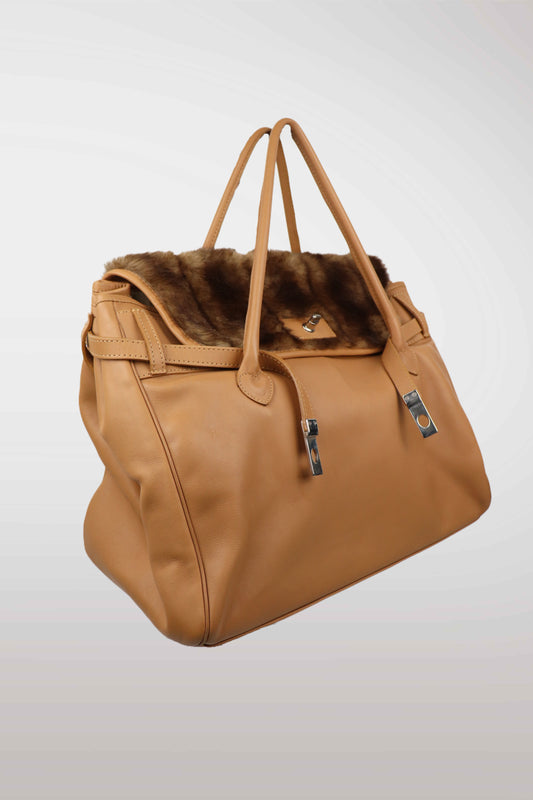 Brown leather bag with fur lining on a white background